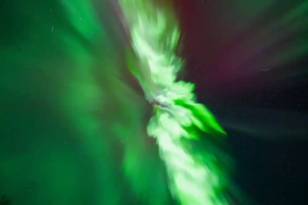 Close-up aurora borealis green and white lights